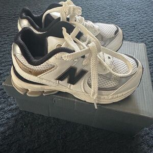 New Balance Kids' White and Black Sneakers with Gold Accents